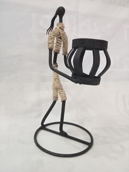 Man holding a candle stand